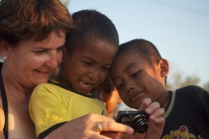 Magda letting the children take photos and share the results.