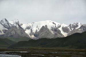 Our camp, just visible, in the shadow of snow capped mountains