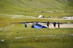 The support lorry climbing precariously up from the river bed