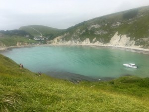 Lulworth Cove with the village and route to Durdle Door behind